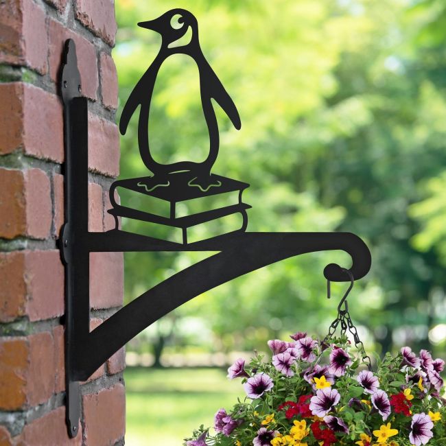 Penguin on Books Hanging Basket Bracket in Garden 