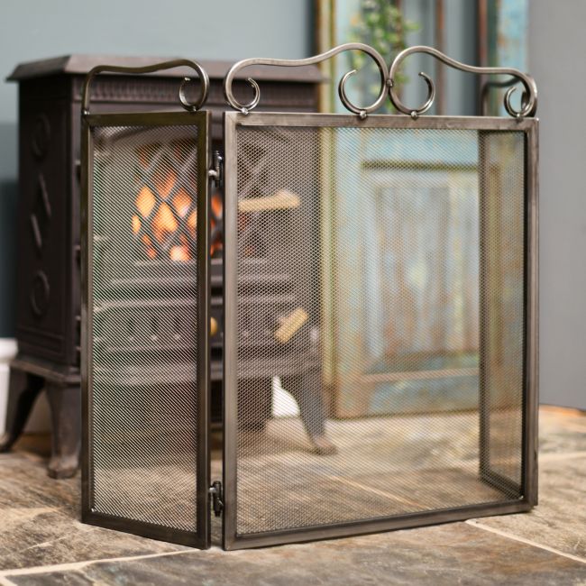 Steel fire guard in living room Steel fire guard in living room
