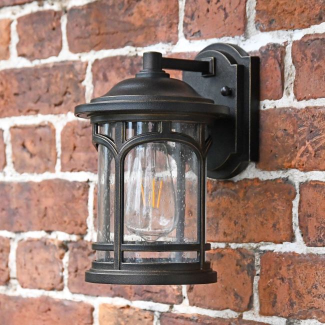 Angled view of bronze wall light in situ Angled view of bronze wall light in situ