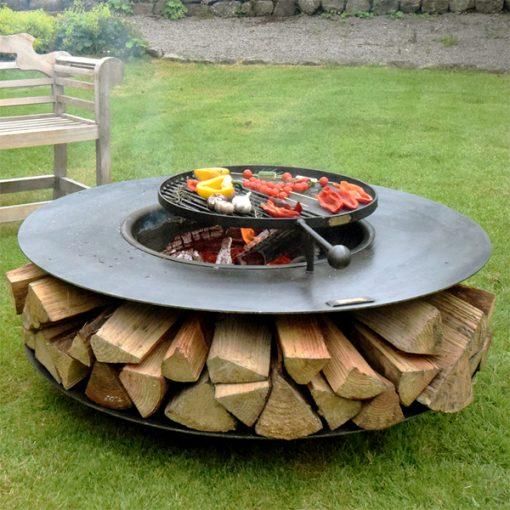 Ring Barbecue Firepit with Log Storage and a Swing Arm Barbecue Rack Cooking View 1 Ring Barbecue Firepit with Log Storage and a Swing Arm Barbecue Rack Cooking View 1