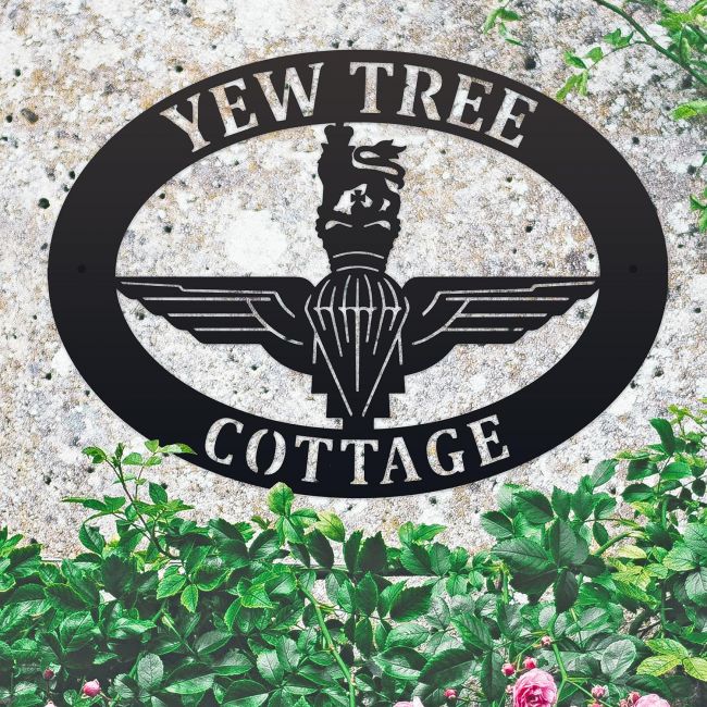 British Parachute Regiment Iron Oval House Sign on a Stone Wall