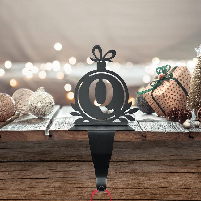 Letter Q Stocking Holder in Situ on a Mantel Piece Letter Q Stocking Holder in Situ on a Mantel Piece
