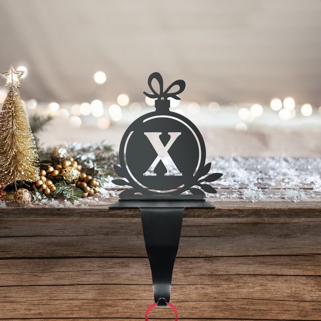 Letter X Stocking Holder in Situ on a Mantel Piece Letter X Stocking Holder in Situ on a Mantel Piece