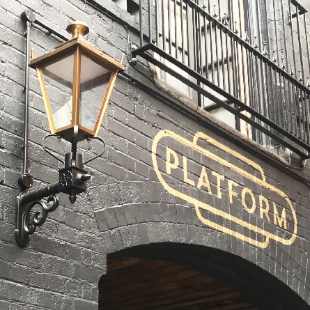 Brass antique-style wall lanterns for pub