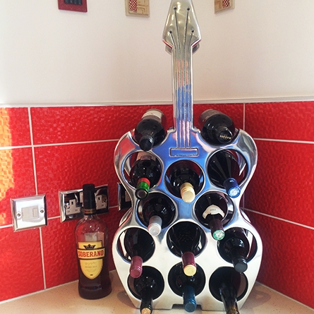 Guitar-shaped wine bottle holder